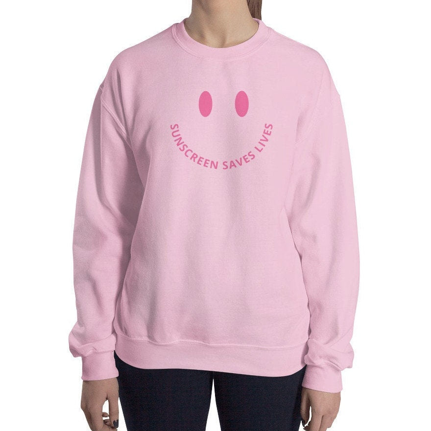 Sunscreen Saves Lives Smiley Face Crewneck, Pink Unisex Sweatshirt